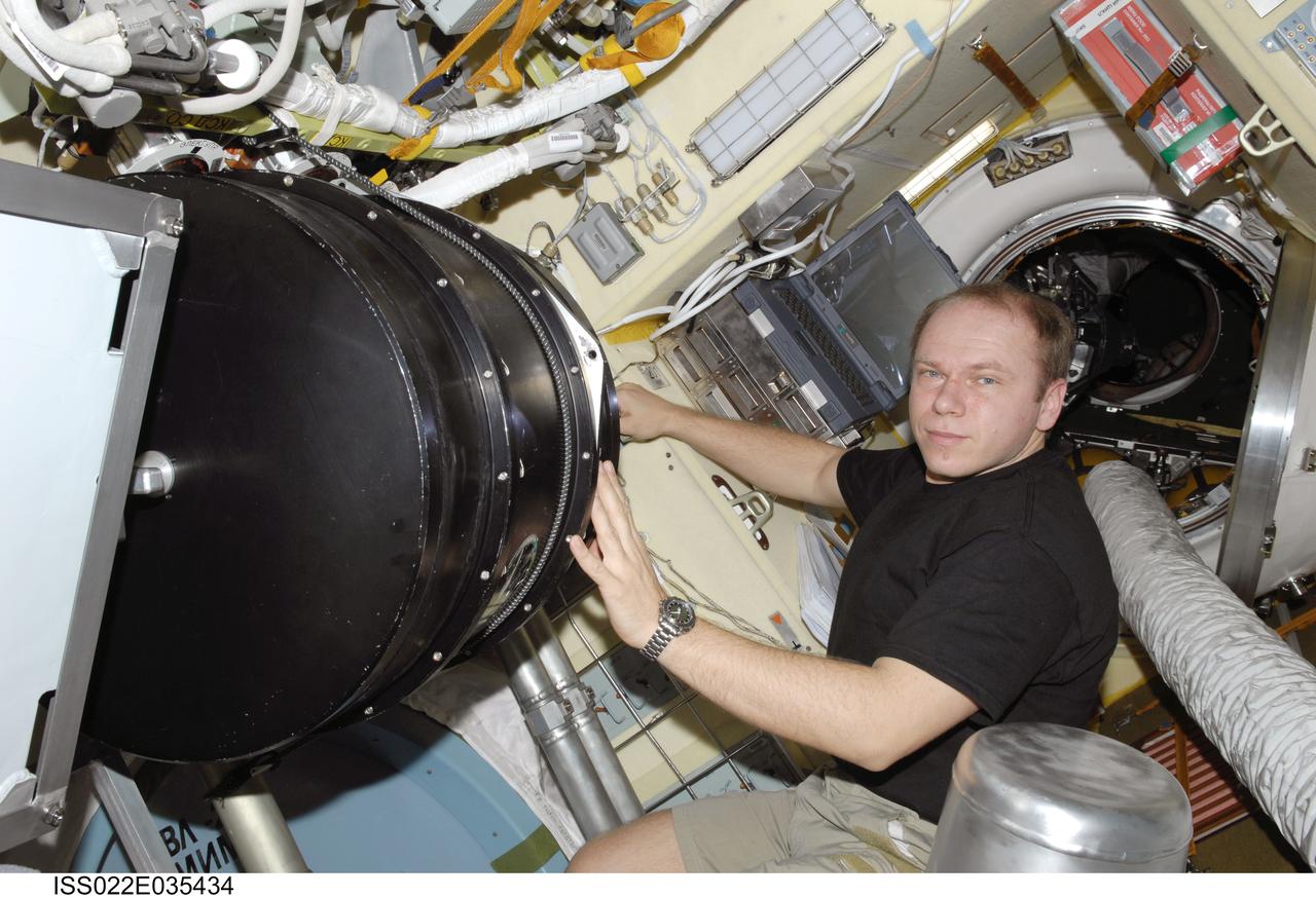 ISS022-E-035434 (25 Jan. 2010) --- Russian cosmonaut Oleg Kotov, Expedition 22 flight engineer, works with the Plasma Crystal-3 experiment in the Zvezda Service Module of the International Space Station.