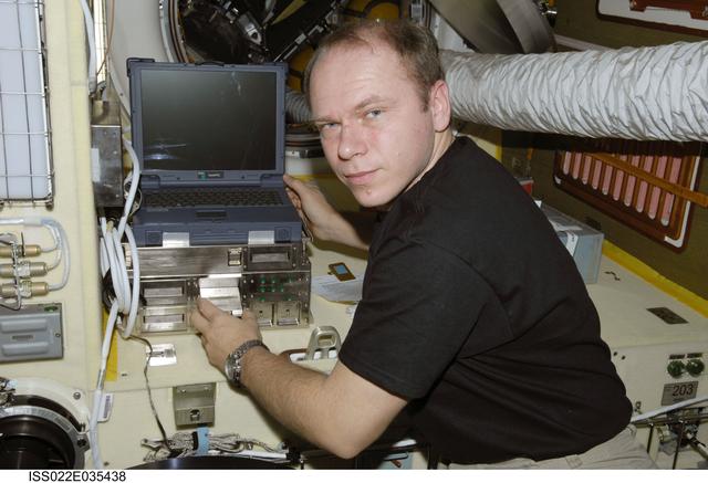 NASA image: Kotov works with Plasma Crystal-3 Experiment in the SM during Expedition 22