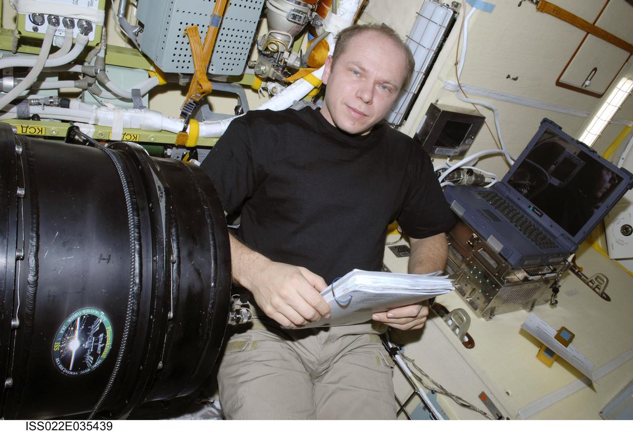 ISS022-E-035439 (25 Jan. 2010) --- Russian cosmonaut Oleg Kotov, Expedition 22 flight engineer, is pictured while working with the Plasma Crystal-3 experiment in the Zvezda Service Module of the International Space Station.