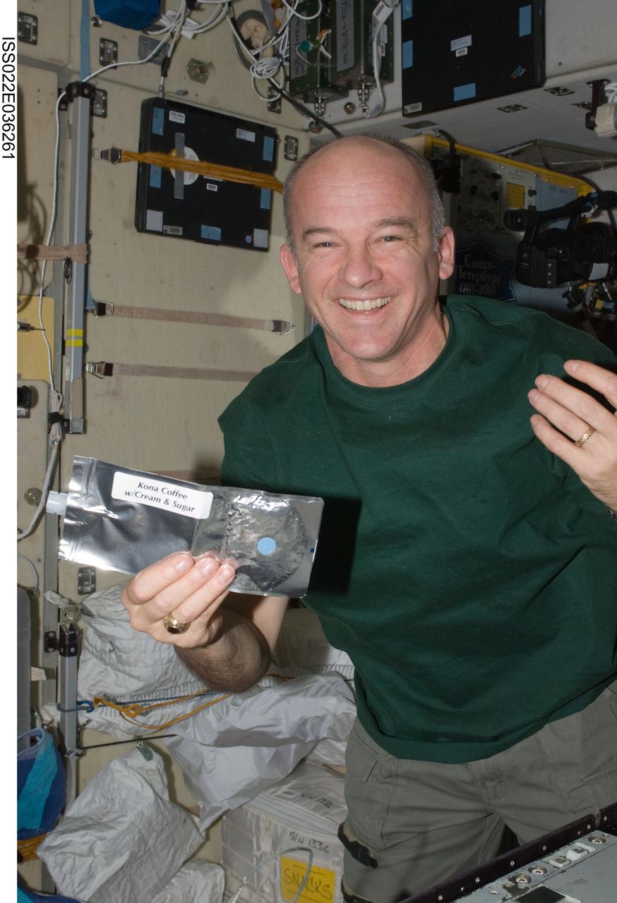 ISS022-E-036261 (21 Jan. 2010) --- NASA astronaut Jeffrey Williams, Expedition 22 commander, poses for a photo with a beverage container in the Zvezda Service Module of the International Space Station.