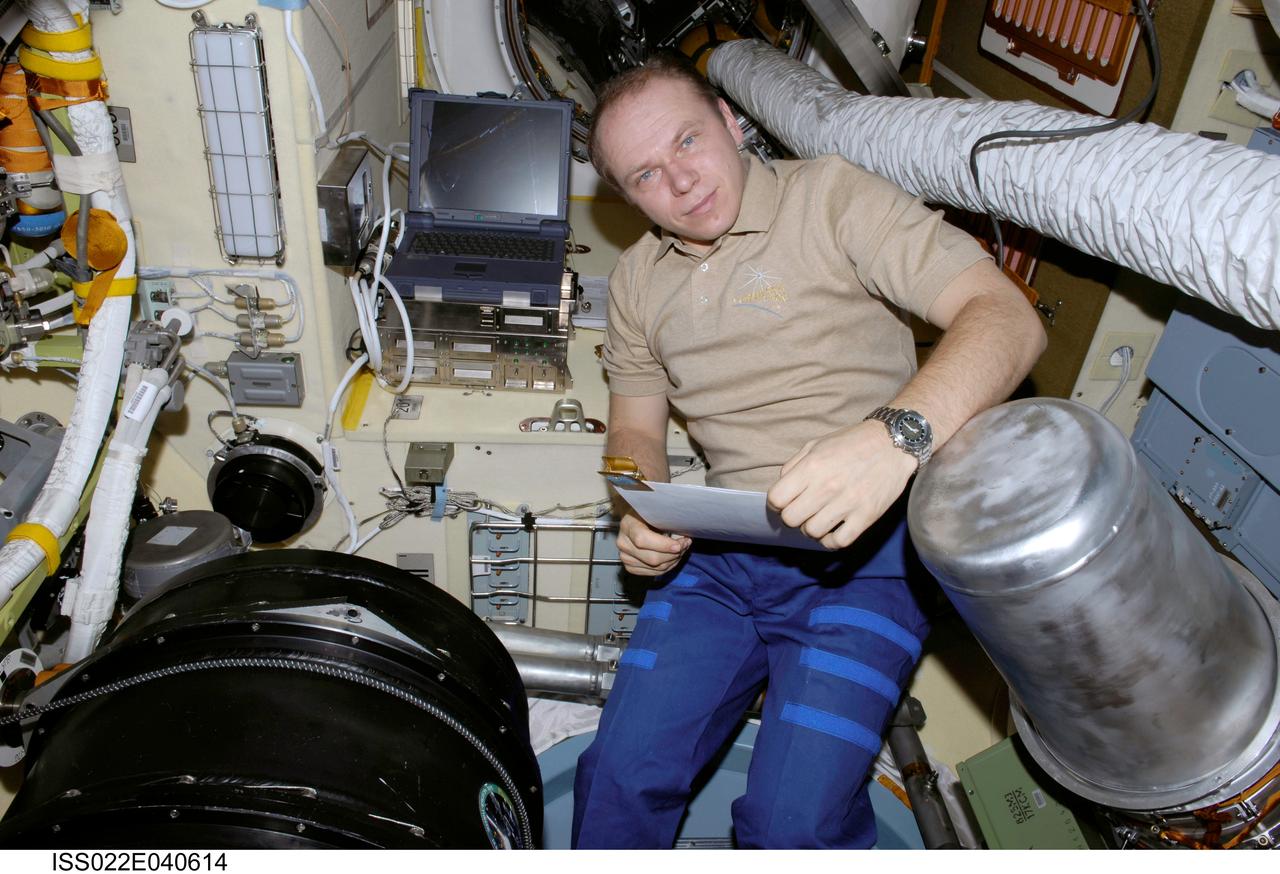 ISS022-E-040614 (28 Jan. 2010) --- Russian cosmonaut Oleg Kotov, Expedition 22 flight engineer, is pictured while working with the Plasma Crystal-3 experiment in the Zvezda Service Module of the International Space Station.