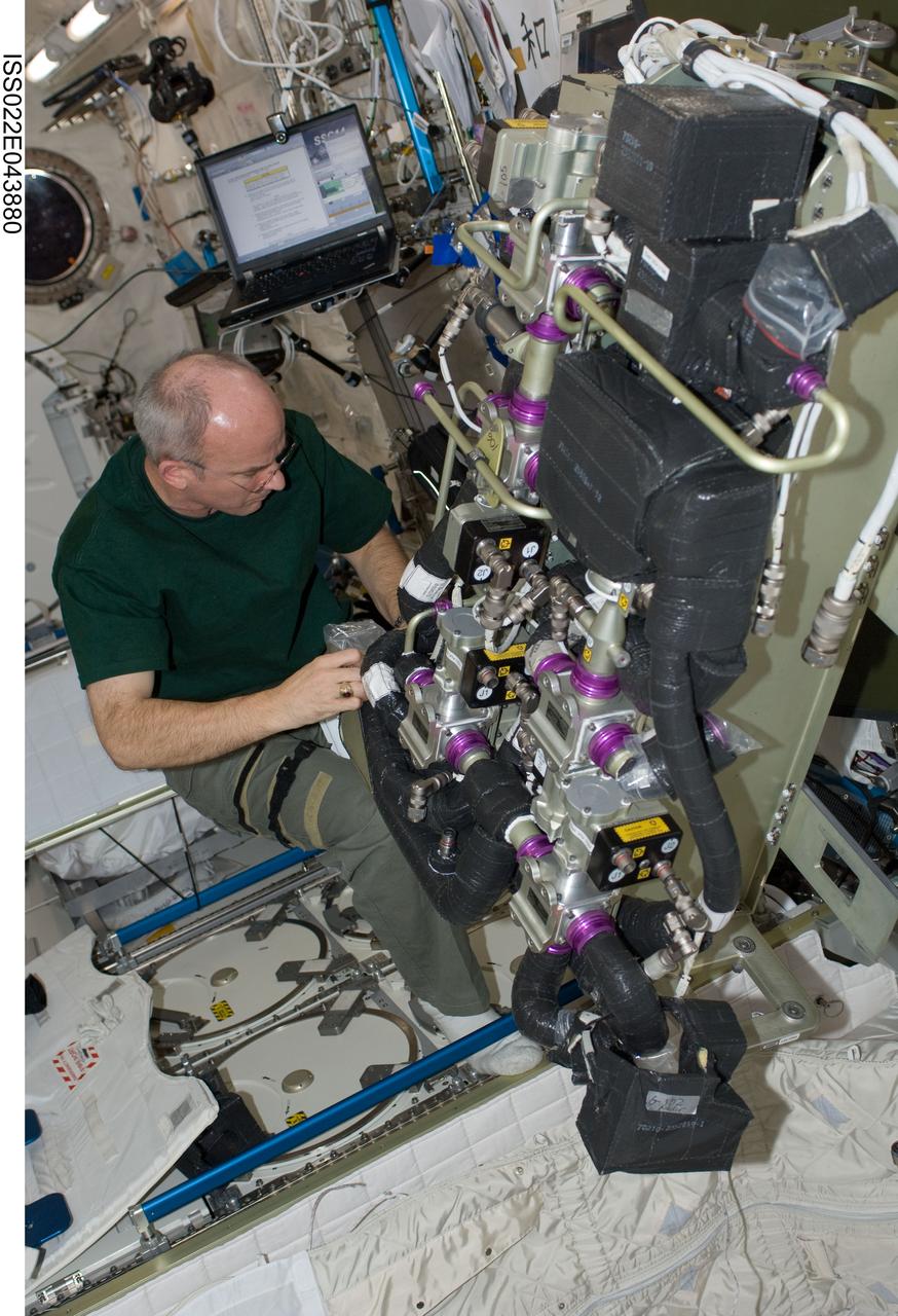 ISS022-E-043880 (28 Jan. 2010) --- NASA astronaut Jeffrey Williams, Expedition 22 commander, performs in-flight maintenance (IFM) on the Carbon Dioxide Removal Assembly (CDRA) in the Kibo laboratory of the International Space Station.
