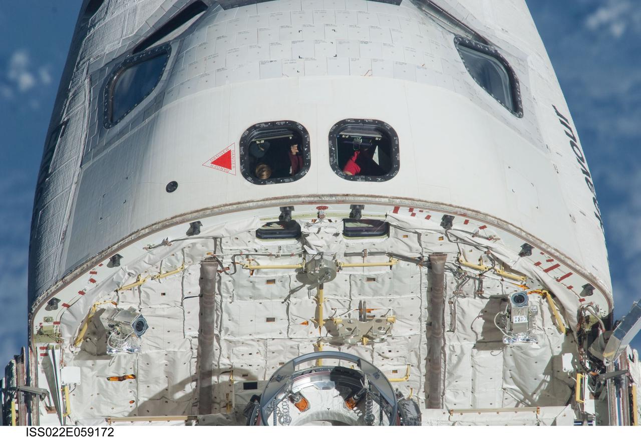 ISS022-E-059172 (9 Feb. 2010) --- This 800mm image, showing the top of space shuttle Endeavour's crew cabin, its firewall and part of the docking mechanism in the cargo bay, was photographed by one of the Expedition 22 crew members aboard the International Space Station. The two spacecraft were in the midst of rendezvous operations, which included a back-flip by the shuttle for the purposes of inspecting and photographing it from a number of angles.