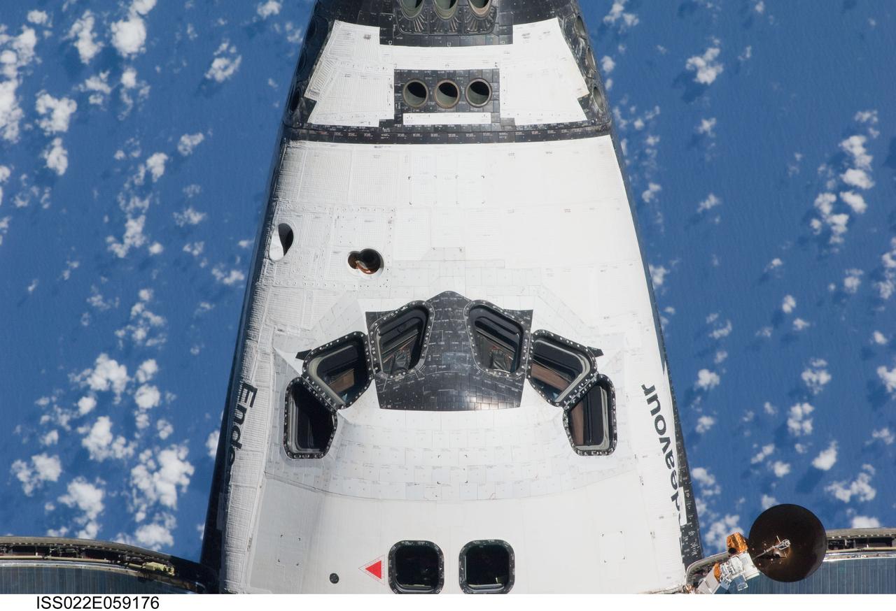 ISS022-E-059176 (9 Feb. 2010) --- This view of the crew cabin of the space shuttle Endeavour was provided by an Expedition 22 crew member during a survey of the approaching vehicle prior to docking with the International Space Station. As part of the survey and part of every mission's activities, the STS-130 Endeavour crew performed a back-flip for the rendezvous pitch maneuver (RPM). The image was photographed with a digital still camera, using a 400mm lens at a distance of about 600 feet (180 meters).
