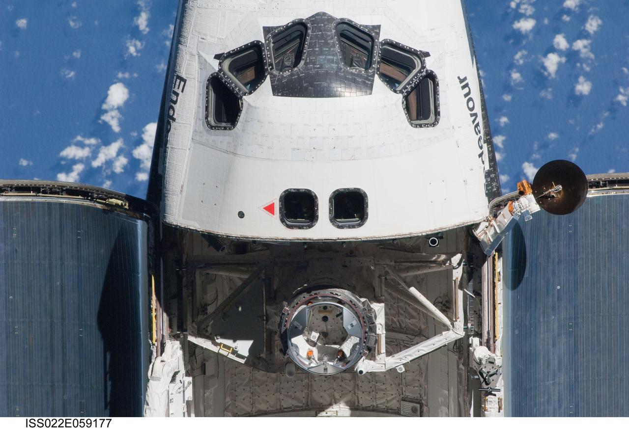 ISS022-E-059177 (9 Feb. 2010) --- This partial view of the crew cabin and forward payload bay of the space shuttle Endeavour was provided by an Expedition 22 crew member during a survey of the approaching vehicle prior to docking with the International Space Station. As part of the survey and part of every mission's activities, the STS-130 Endeavour crew performed a back-flip for the rendezvous pitch maneuver (RPM). The image was photographed with a digital still camera, using a 400mm lens at a distance of about 600 feet (180 meters).