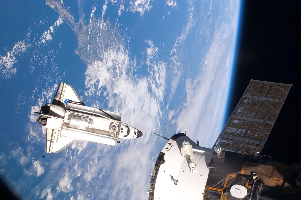 ISS022-E-059298 (9 Feb. 2010) --- Seen flying above part of North Island, New Zealand, the space shuttle Endeavour is featured in this image photographed by an Expedition 22 crew member during STS-130 rendezvous and docking operations with the International Space Station. Docking occurred at 11:06 p.m. (CST) on Feb. 9, 2010.