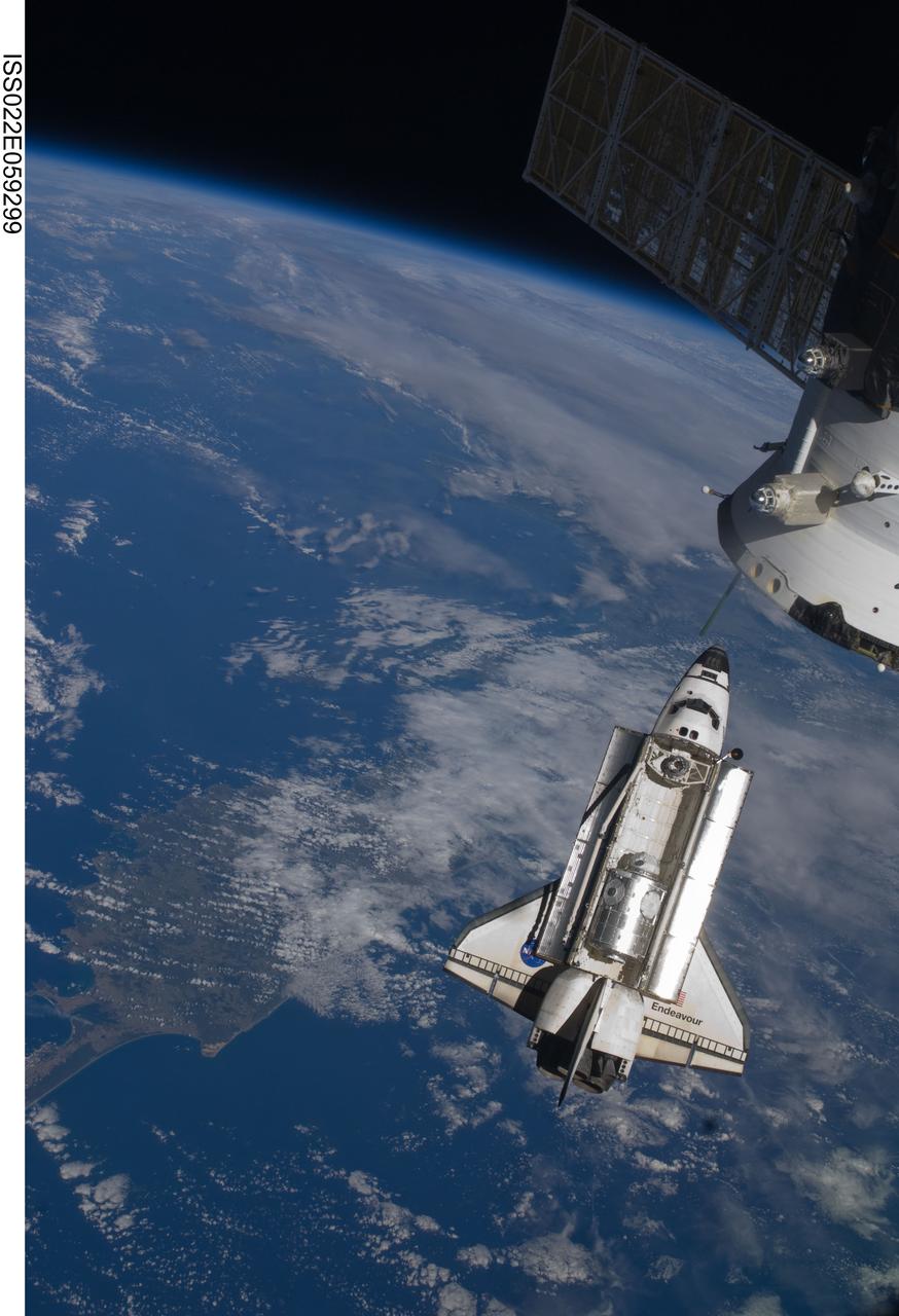 ISS022-E-059299 (9 Feb. 2010) --- Seen flying above part of North Island, New Zealand, the space shuttle Endeavour is featured in this image photographed by an Expedition 22 crew member during STS-130 rendezvous and docking operations with the International Space Station. Docking occurred at 11:06 p.m. (CST) on Feb. 9, 2010.