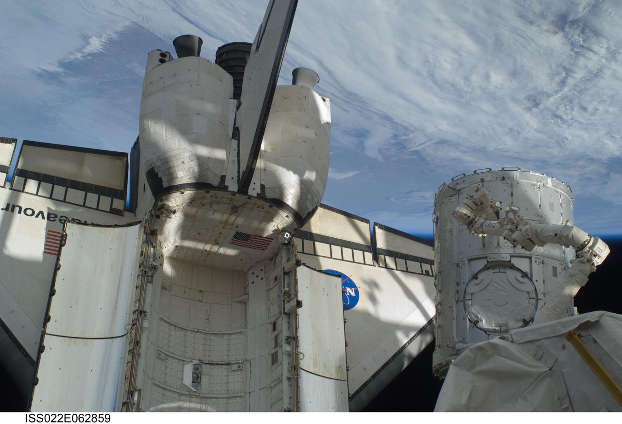 ISS022-E-062859 (11 Feb. 2010) --- In the grasp of the station?s Canadarm2, the Tranquility module is transferred from its stowage position in space shuttle Endeavour?s (STS-130) payload bay to position it on the port side of the Unity node of the International Space Station. Tranquility was locked in place with 16 remotely-controlled bolts. Earth?s horizon and the blackness of space provide the backdrop for the scene.