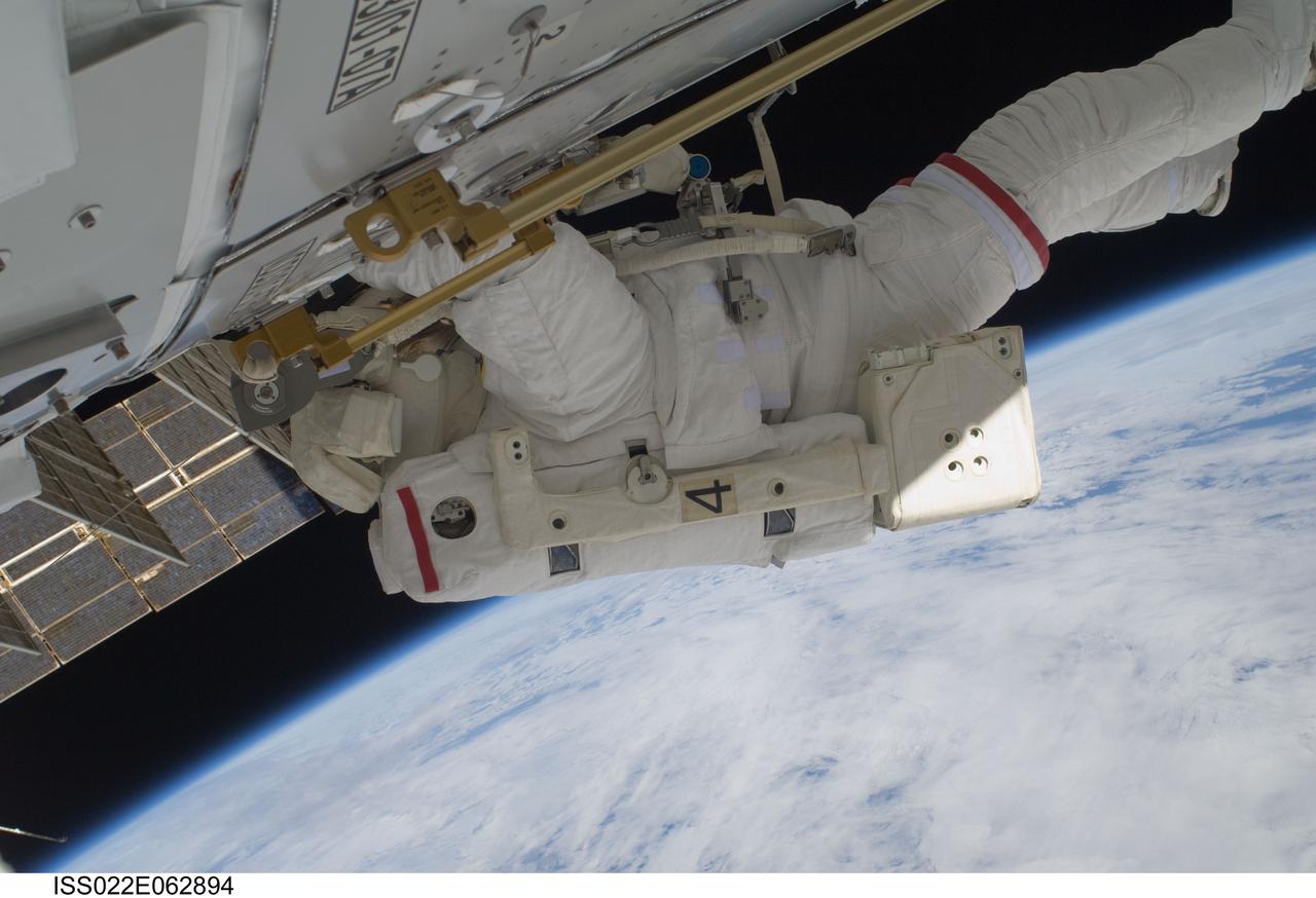 ISS022-E-062894 (11 Feb. 2010) --- NASA astronaut Robert Behnken, STS-130 mission specialist, participates in the mission's first session of extravehicular activity (EVA) as construction and maintenance continue on the International Space Station. During the 6-hour, 32-minute spacewalk, Behnken and astronaut Nicholas Patrick (out of frame), mission specialist, relocated a temporary platform from the Special Purpose Dexterous Manipulator, or Dextre, to the station?s truss structure and installed two handles on the robot. Once Tranquility was structurally mated to Unity, the spacewalkers connected heater and data cables that will integrate the new module with the rest of the station?s systems. They also pre-positioned insulation blankets and ammonia hoses that will be used to connect Tranquility to the station?s cooling radiators during the mission?s second spacewalk.