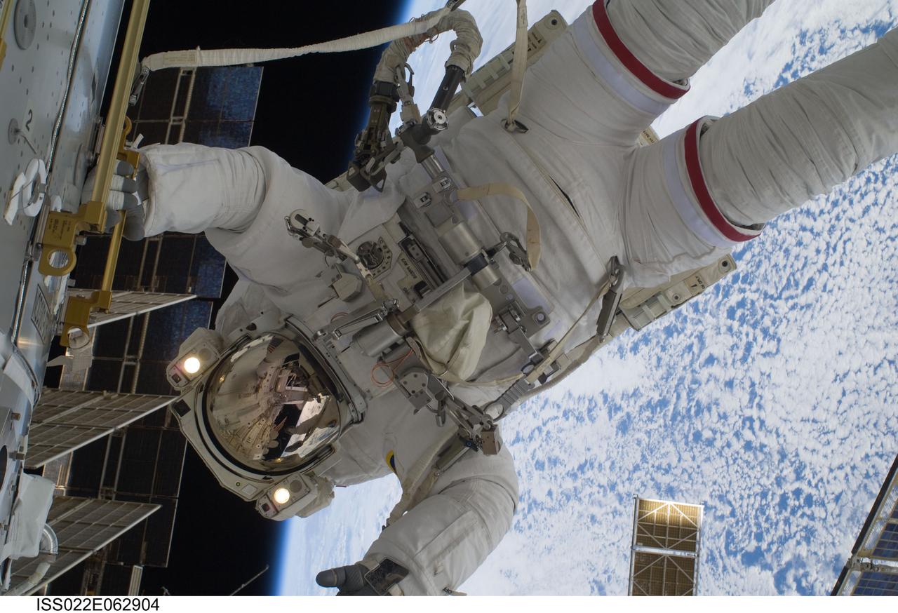 ISS022-E-062904 (11 Feb. 2010) --- NASA astronaut Robert Behnken, STS-130 mission specialist, participates in the mission's first session of extravehicular activity (EVA) as construction and maintenance continue on the International Space Station. During the 6-hour, 32-minute spacewalk, Behnken and astronaut Nicholas Patrick (out of frame), mission specialist, relocated a temporary platform from the Special Purpose Dexterous Manipulator, or Dextre, to the station?s truss structure and installed two handles on the robot. Once Tranquility was structurally mated to Unity, the spacewalkers connected heater and data cables that will integrate the new module with the rest of the station?s systems. They also pre-positioned insulation blankets and ammonia hoses that will be used to connect Tranquility to the station?s cooling radiators during the mission?s second spacewalk.
