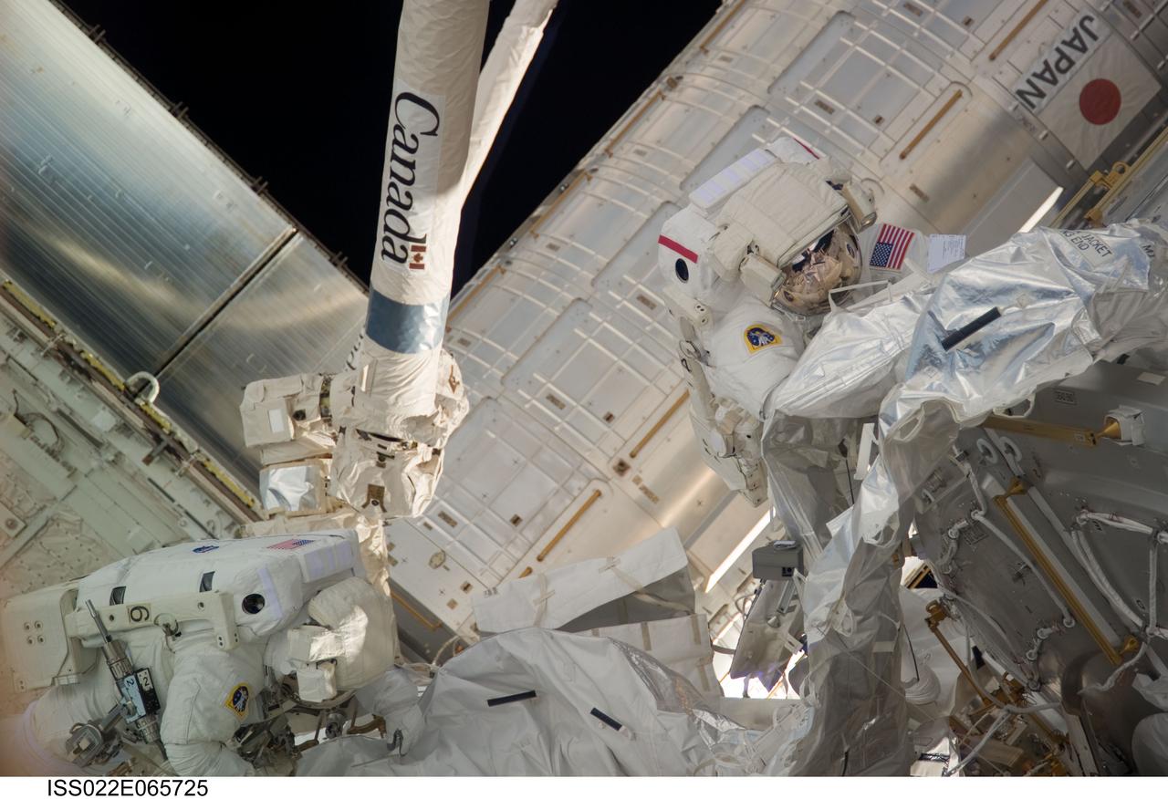 ISS022-E-065725 (14 Feb. 2010) --- NASA astronauts Robert Behnken (right) and Nicholas Patrick, both STS-130 mission specialists, participate in the mission?s second session of extravehicular activity (EVA) as construction and maintenance continue on the International Space Station. During the five-hour, 54-minute spacewalk, Behnken and Patrick connected two ammonia coolant loops, installed thermal covers around the ammonia hoses, outfitted the Earth-facing port on the Tranquility node for the relocation of its Cupola, and installed handrails and a vent valve on the new module.