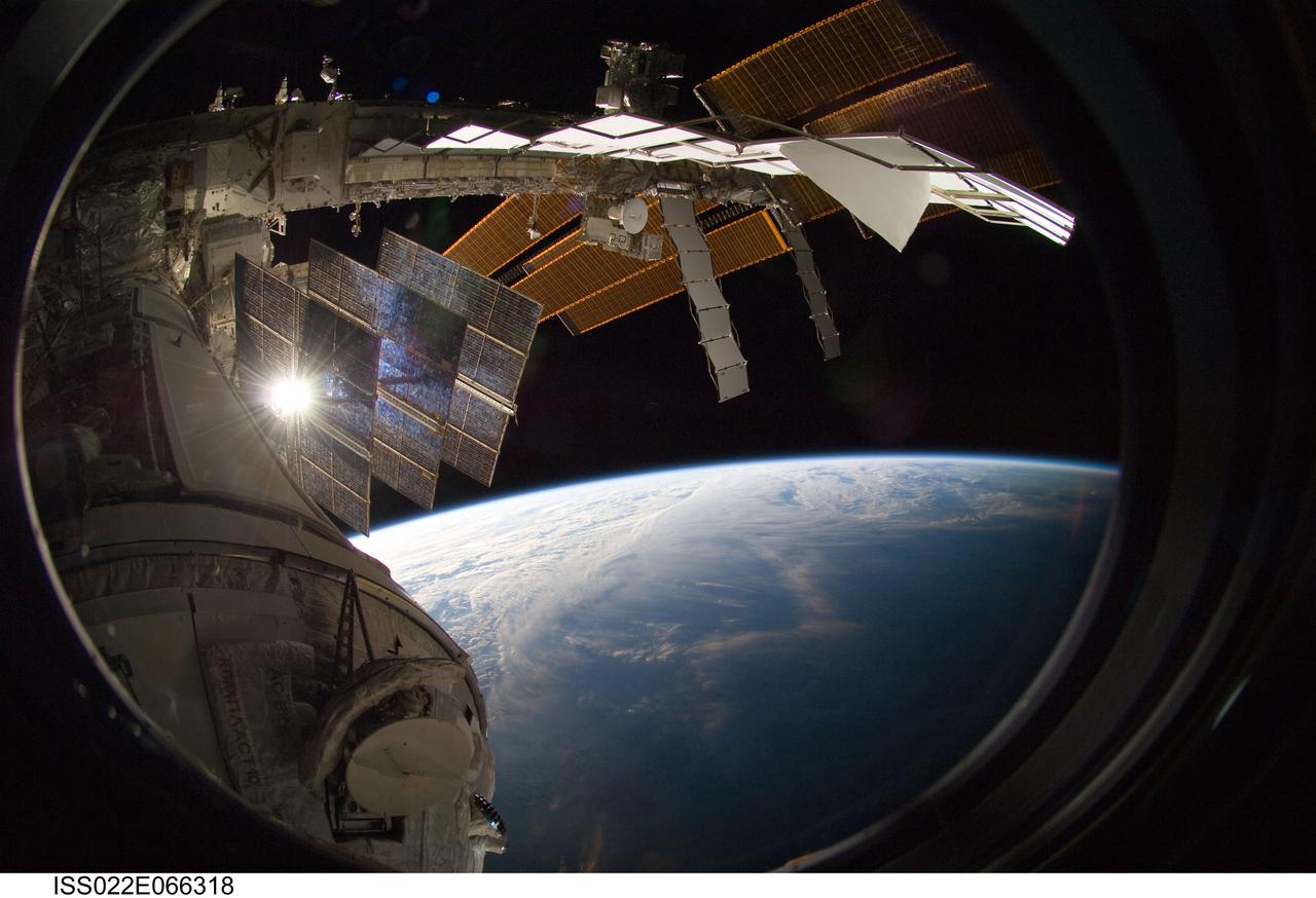 ISS022-E-066318 (15 Feb. 2010) --- Backdropped by Earth?s horizon and the blackness of space, a portion of the International Space Station is featured in this image photographed by a crew member on the ISS while space shuttle Endeavour (STS-130) remains docked with the station.