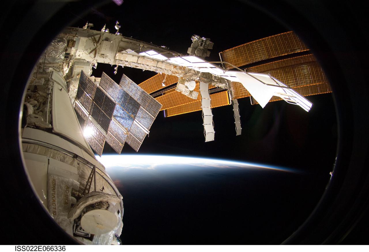 ISS022-E-066336 (15 Feb. 2010) --- Backdropped by Earth?s horizon and the blackness of space, a portion of the International Space Station is featured in this image photographed by a crew member on the ISS while space shuttle Endeavour (STS-130) remains docked with the station.