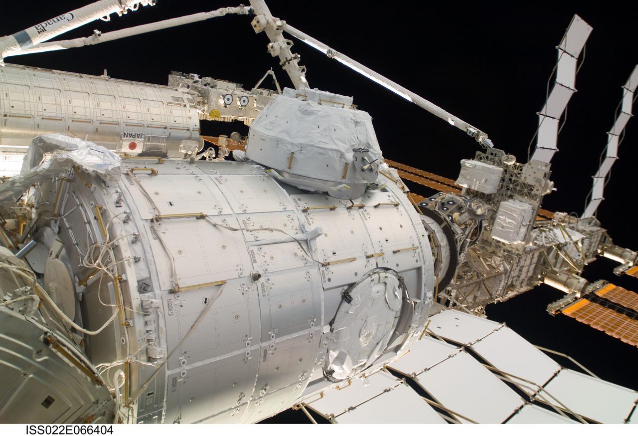 ISS022-E-066404 (16 Feb. 2010) --- In the grasp of the Canadarm2, the Pressurized Mating Adapter 3 (PMA-3) is relocated from the Harmony node to the open port on the end of the newly-installed Tranquility node. NASA astronauts Robert Behnken and Nicholas Patrick, both STS-130 mission specialists, operated the station?s robotic arm for the move, while Jeffrey Williams, Expedition 22 commander; and Japan Aerospace Exploration Agency (JAXA) astronaut Soichi Noguchi, Expedition 22 flight engineer, dealt with latches and bolts, connecting the port to its new home. Tranquility?s Cupola is visible at top center.