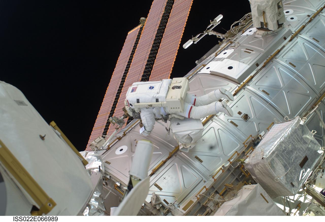 ISS022-E-066989 (17 Feb. 2010) --- NASA astronaut Robert Behnken, STS-130 mission specialist, participates in the mission?s third and final session of extravehicular activity (EVA) as construction and maintenance continue on the International Space Station. During the five-hour, 48-minute spacewalk, Behnken and Nicholas Patrick (out of frame), mission specialist, completed all of their planned tasks, removing insulation blankets and removing launch restraint bolts from each of the Cupola?s seven windows.