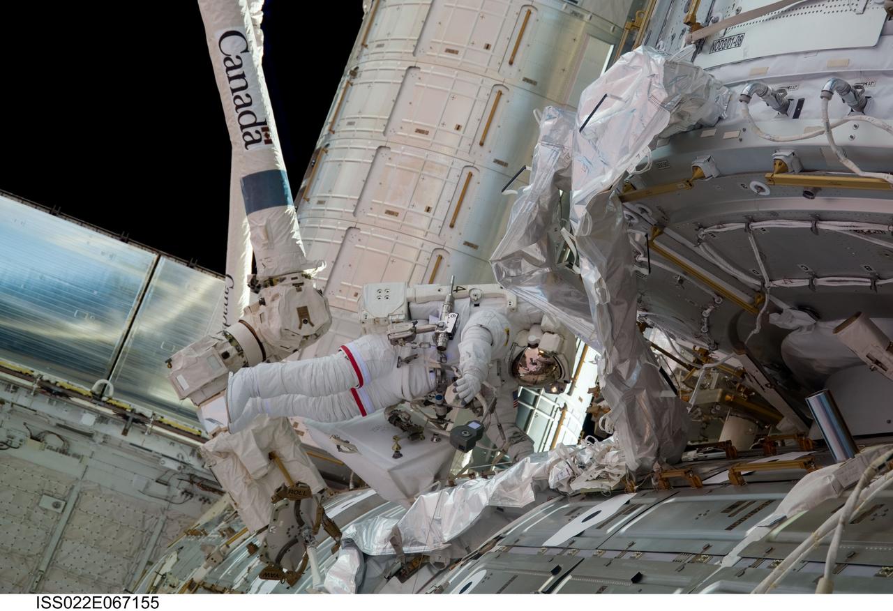 ISS022-E-067155 (17 Feb. 2010) --- NASA astronaut Robert Behnken, STS-130 mission specialist, participates in the mission?s third and final session of extravehicular activity (EVA) as construction and maintenance continue on the International Space Station. During the five-hour, 48-minute spacewalk, Behnken and Nicholas Patrick (out of frame), mission specialist, completed all of their planned tasks, removing insulation blankets and removing launch restraint bolts from each of the Cupola?s seven windows.