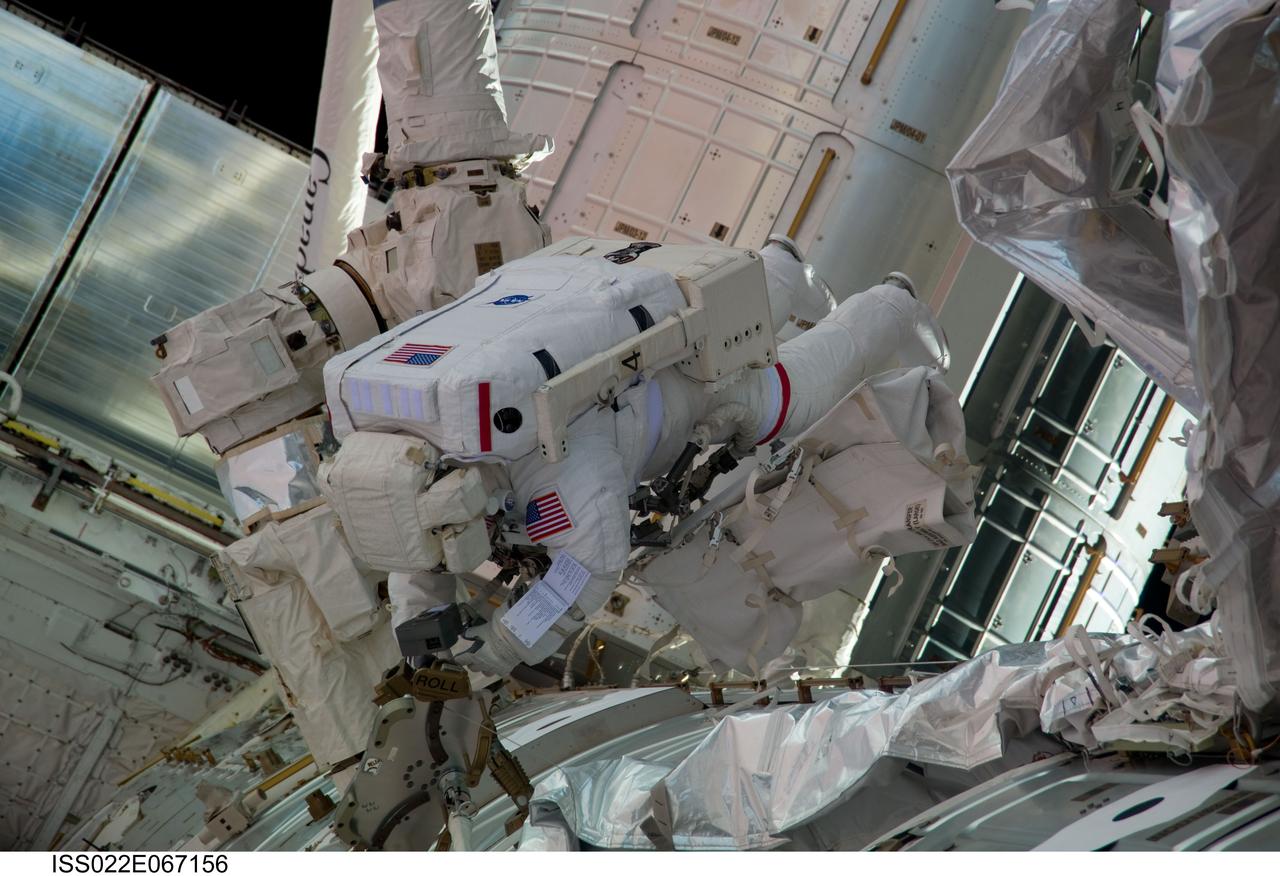 ISS022-E-067156 (17 Feb. 2010) --- NASA astronaut Robert Behnken, STS-130 mission specialist, participates in the mission?s third and final session of extravehicular activity (EVA) as construction and maintenance continue on the International Space Station. During the five-hour, 48-minute spacewalk, Behnken and Nicholas Patrick (out of frame), mission specialist, completed all of their planned tasks, removing insulation blankets and removing launch restraint bolts from each of the Cupola?s seven windows.