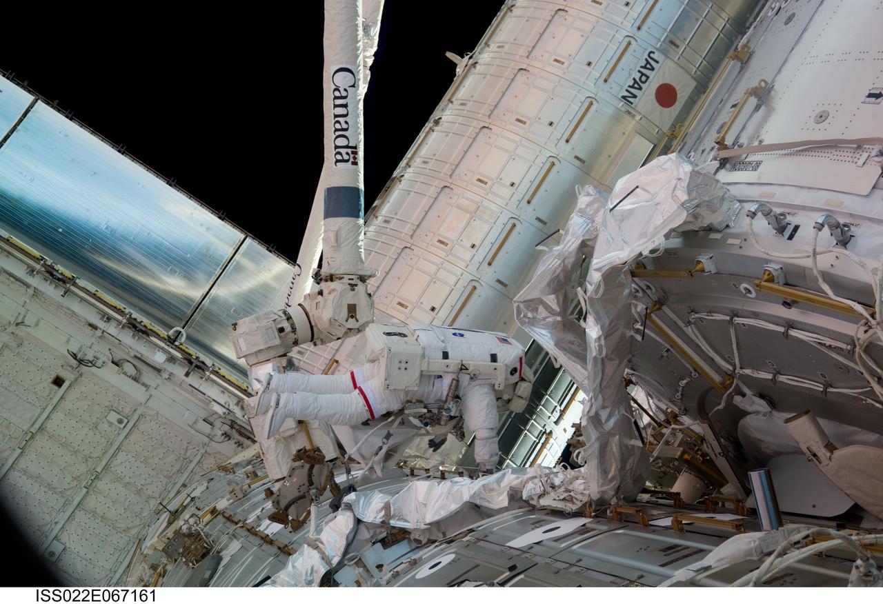 ISS022-E-067161 (17 Feb. 2010) --- NASA astronaut Robert Behnken, STS-130 mission specialist, participates in the mission?s third and final session of extravehicular activity (EVA) as construction and maintenance continue on the International Space Station. During the five-hour, 48-minute spacewalk, Behnken and Nicholas Patrick (out of frame), mission specialist, completed all of their planned tasks, removing insulation blankets and removing launch restraint bolts from each of the Cupola?s seven windows.