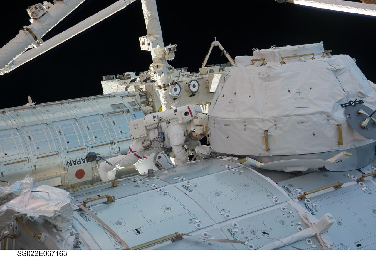 ISS022-E-067163 (17 Feb. 2010) --- NASA astronaut Robert Behnken, STS-130 mission specialist, participates in the mission?s third and final session of extravehicular activity (EVA) as construction and maintenance continue on the International Space Station. During the five-hour, 48-minute spacewalk, Behnken and Nicholas Patrick (out of frame), mission specialist, completed all of their planned tasks, removing insulation blankets and removing launch restraint bolts from each of the Cupola?s seven windows.