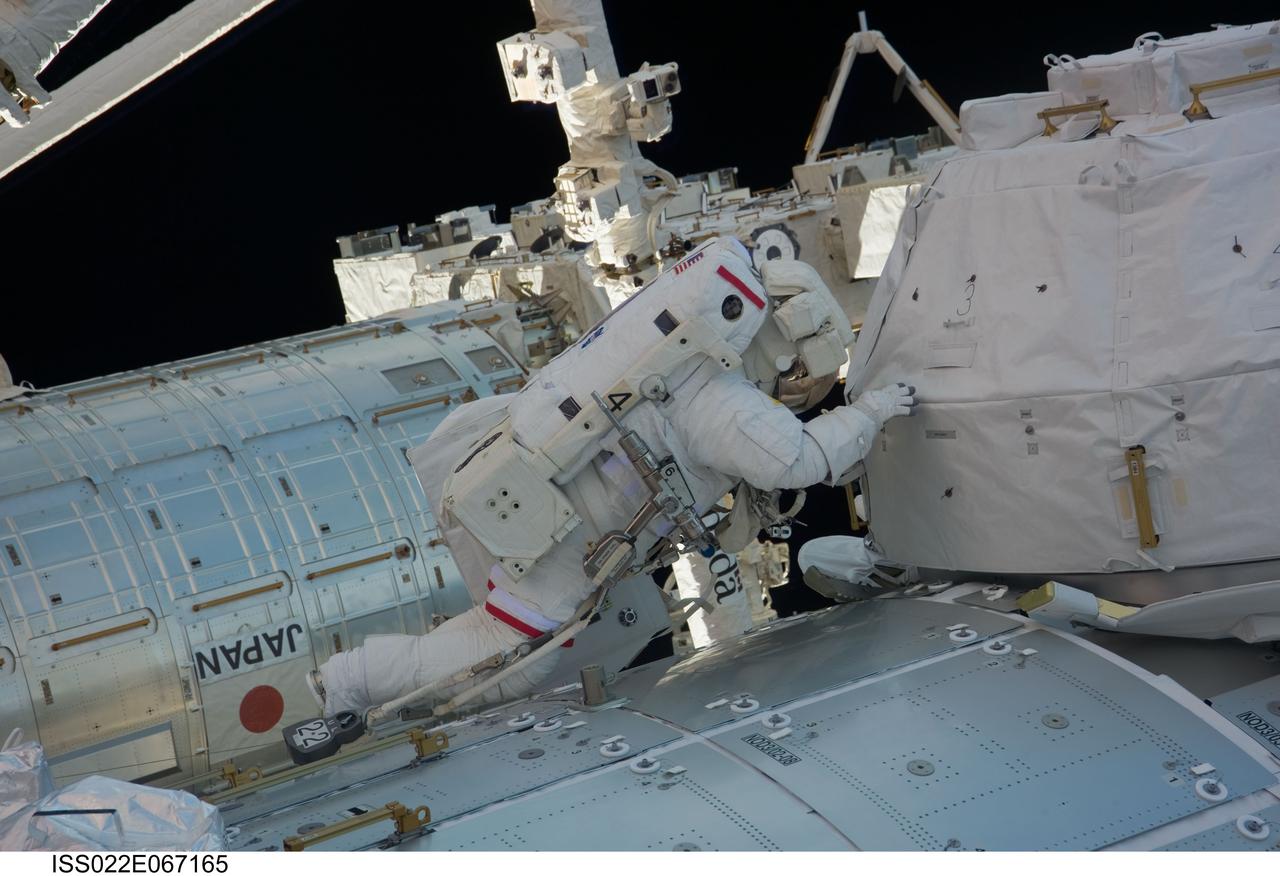 ISS022-E-067165 (17 Feb. 2010) --- NASA astronaut Robert Behnken, STS-130 mission specialist, participates in the mission?s third and final session of extravehicular activity (EVA) as construction and maintenance continue on the International Space Station. During the five-hour, 48-minute spacewalk, Behnken and Nicholas Patrick (out of frame), mission specialist, completed all of their planned tasks, removing insulation blankets and removing launch restraint bolts from each of the Cupola?s seven windows.