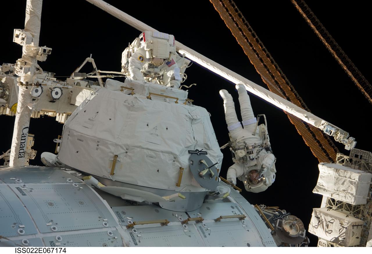 ISS022-E-067174 (17 Feb. 2010) --- NASA astronauts Nicholas Patrick (right) and Robert Behnken, both STS-130 mission specialists, participate in the mission?s third and final session of extravehicular activity (EVA) as construction and maintenance continue on the International Space Station. During the five-hour, 48-minute spacewalk, Patrick and Behnken completed all of their planned tasks, removing insulation blankets and removing launch restraint bolts from each of the Cupola?s seven windows.
