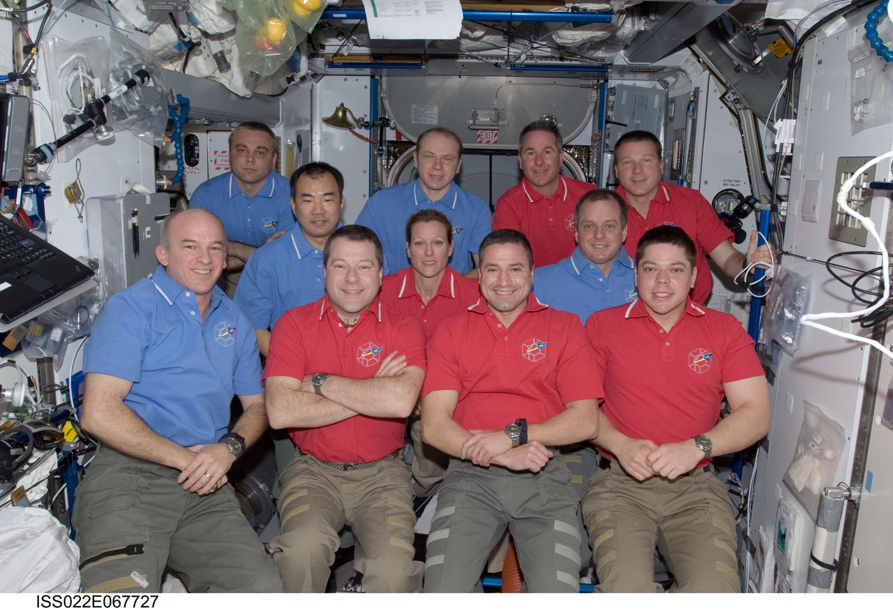 ISS022-E-067727 (17 Feb. 2010) --- STS-130 and Expedition 22 crew members gather for a group portrait in the Harmony node of the International Space Station while space shuttle Endeavour remains docked with the station. Pictured from the left (front row) are NASA astronauts Jeffrey Williams, Expedition 22 commander; Nicholas Patrick, STS-130 mission specialist; George Zamka, STS-130 commander; and Robert Behnken, STS-130 mission specialist. Pictured from the left (middle row) are Japan Aerospace Exploration Agency (JAXA) astronaut Soichi Noguchi, Expedition 22 flight engineer; NASA astronauts Kathryn Hire, STS-130 mission specialist; and T.J. Creamer, Expedition 22 flight engineer. Pictured from the left (back row) are Russian cosmonauts Maxim Suraev and Oleg Kotov, both Expedition 22 flight engineer; along with NASA astronauts Stephen Robinson, STS-130 mission specialist; and Terry Virts, STS-130 pilot.