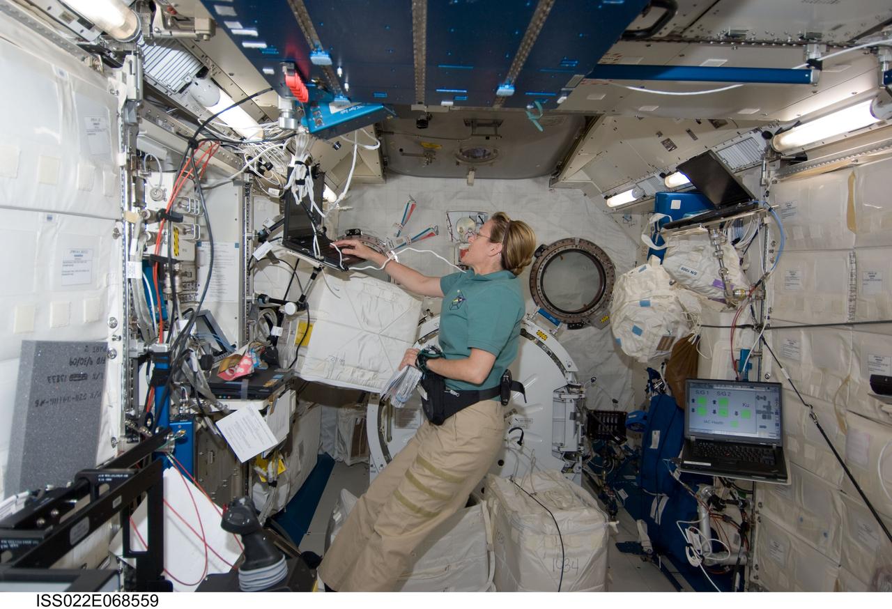 ISS022-E-068559 (18 Feb. 2010) --- NASA astronaut Kathryn Hire, STS-130 mission specialist, works in the Kibo laboratory of the International Space Station while space shuttle Endeavour remains docked with the station.