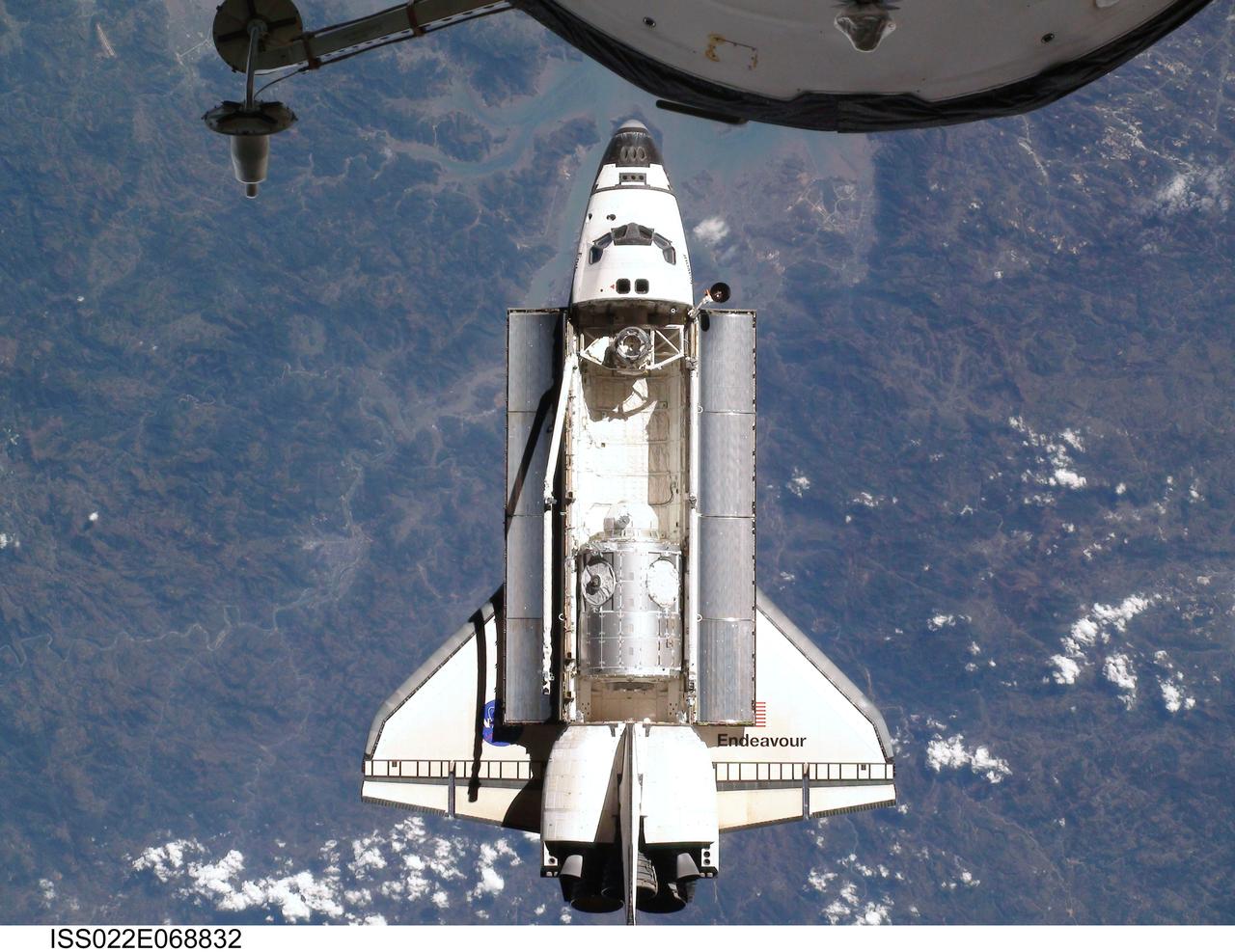 ISS022-E-068832 (9 Feb. 2010) --- This view of the space shuttle Endeavour, taken on Feb. 9 from the International Space Station as the two spacecraft conducted their rendezvous operations, was downlinked by the Expedition 22 crew on Feb. 19. The Tranquility node and the Cupola can be clearly seen in the shuttle's payload bay.