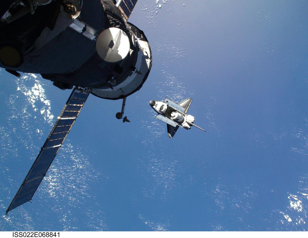 ISS022-E-068841 (9 Feb. 2010) --- This view of the space shuttle Endeavour, taken on Feb. 9 from the International Space Station as the two spacecraft conducted their rendezvous operations, was downlinked by the Expedition 22 crew on Feb. 19. A Russian spacecraft is docked to the station in the foreground.