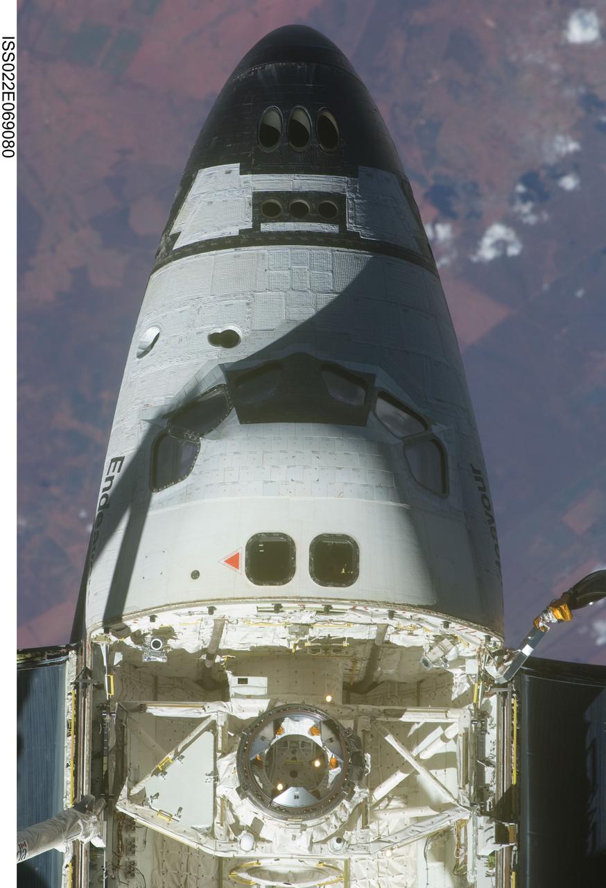 ISS022-E-069080 (19 Feb. 2010) --- This view of the crew cabin and forward payload bay of the space shuttle Endeavour was provided by an Expedition 22 crew member on the International Space Station soon after the shuttle and station began their post-undocking relative separation. Undocking of the two spacecraft occurred at 7:54 p.m. (EST) on Feb. 19, 2010.