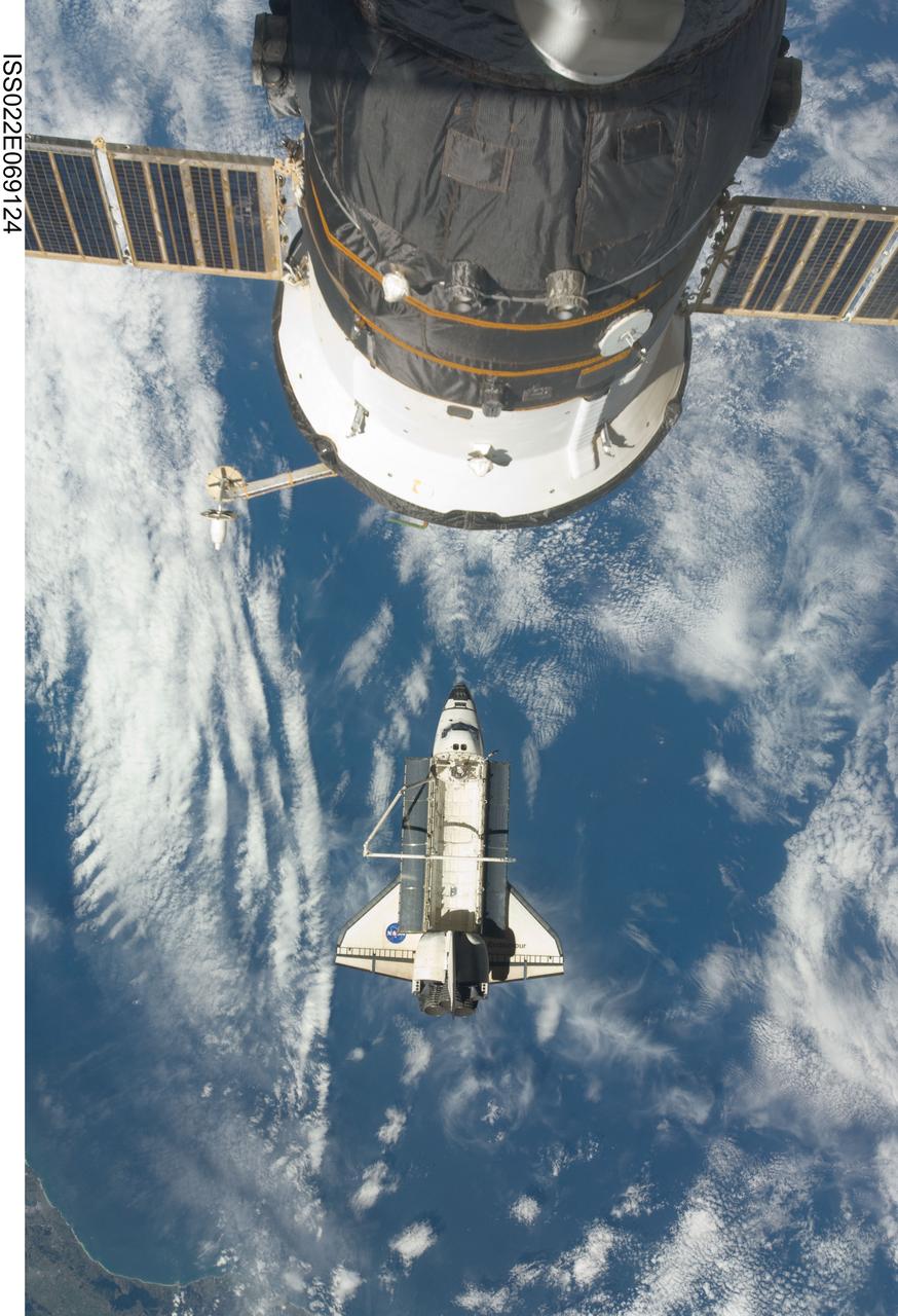 ISS022-E-069124 (19 Feb. 2010) --- The space shuttle Endeavour is featured in this image photographed by an Expedition 22 crew member on the International Space Station soon after the shuttle and station began their post-undocking relative separation. Undocking of the two spacecraft occurred at 7:54 p.m. (EST) on Feb. 19, 2010. A Russian spacecraft docked with the station is at top.