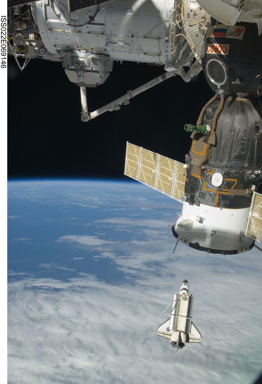ISS022-E-069146 (19 Feb. 2010) --- The space shuttle Endeavour is featured in this image photographed by an Expedition 22 crew member on the International Space Station soon after the shuttle and station began their post-undocking relative separation. Undocking of the two spacecraft occurred at 7:54 p.m. (EST) on Feb. 19, 2010. Also pictured are the newly-installed Tranquility node and Cupola; along with a Russian Soyuz spacecraft docked with the station. Earth?s horizon and the blackness of space provide the backdrop for the scene.