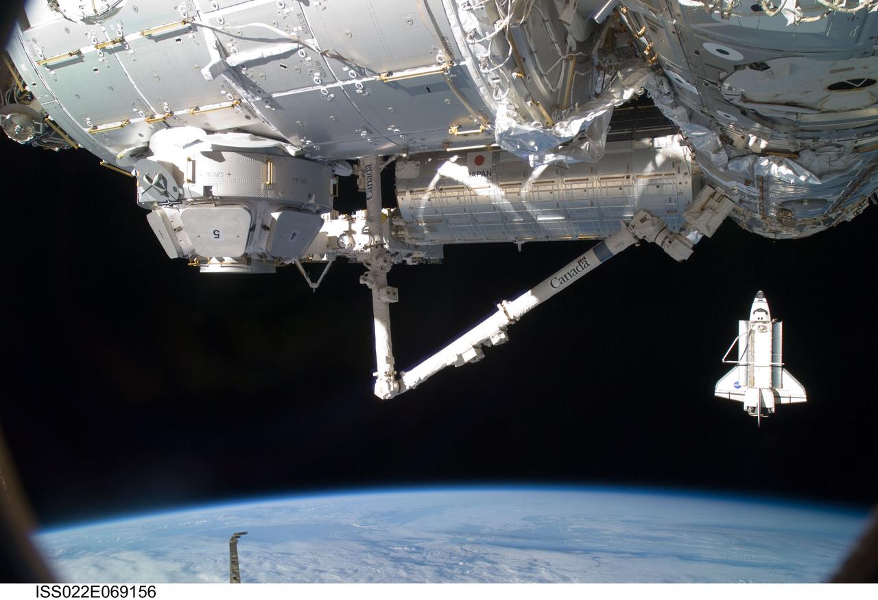 ISS022-E-069156 (19 Feb. 2010) --- The space shuttle Endeavour is featured in this image photographed by an Expedition 22 crew member on the International Space Station soon after the shuttle and station began their post-undocking relative separation. Undocking of the two spacecraft occurred at 7:54 p.m. (EST) on Feb. 19, 2010. Also pictured are the newly-installed Tranquility node and Cupola (top foreground); along with the Canadarm2 and the Japanese Kibo complex. Earth?s horizon and the blackness of space provide the backdrop for the scene.