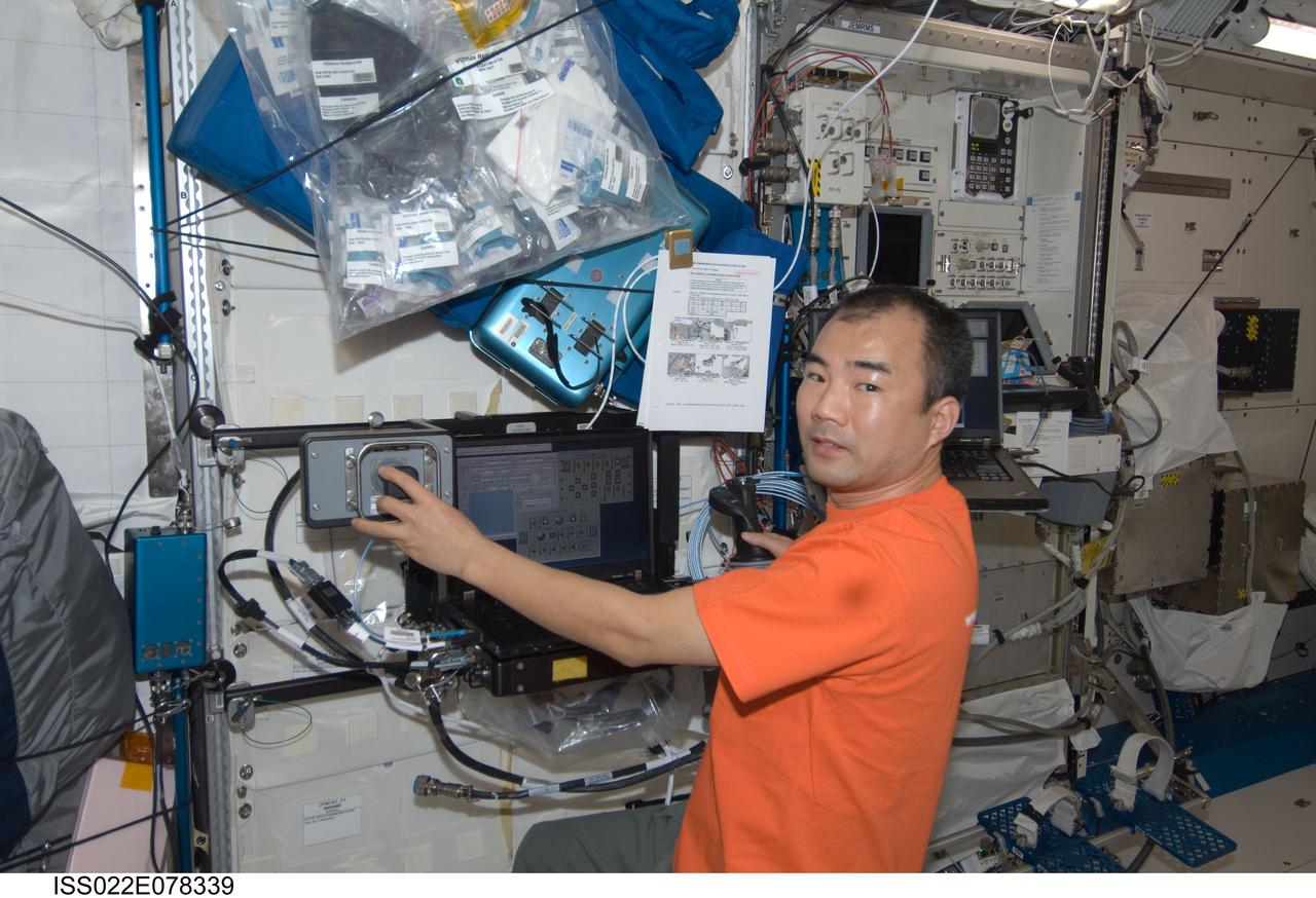 ISS022-E-078339 (2 March 2010) --- Japan Aerospace Exploration Agency (JAXA) astronaut Soichi Noguchi, Expedition 22 flight engineer, works at a robotic workstation in the Kibo laboratory of the International Space Station.
