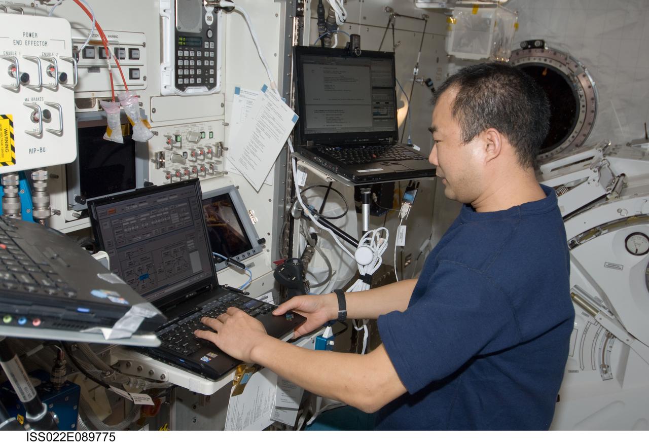 ISS022-E-089775 (10 March 2010) --- Japan Aerospace Exploration Agency (JAXA) astronaut Soichi Noguchi, Expedition 22 flight engineer, uses a computer in the Kibo laboratory of the International Space Station.