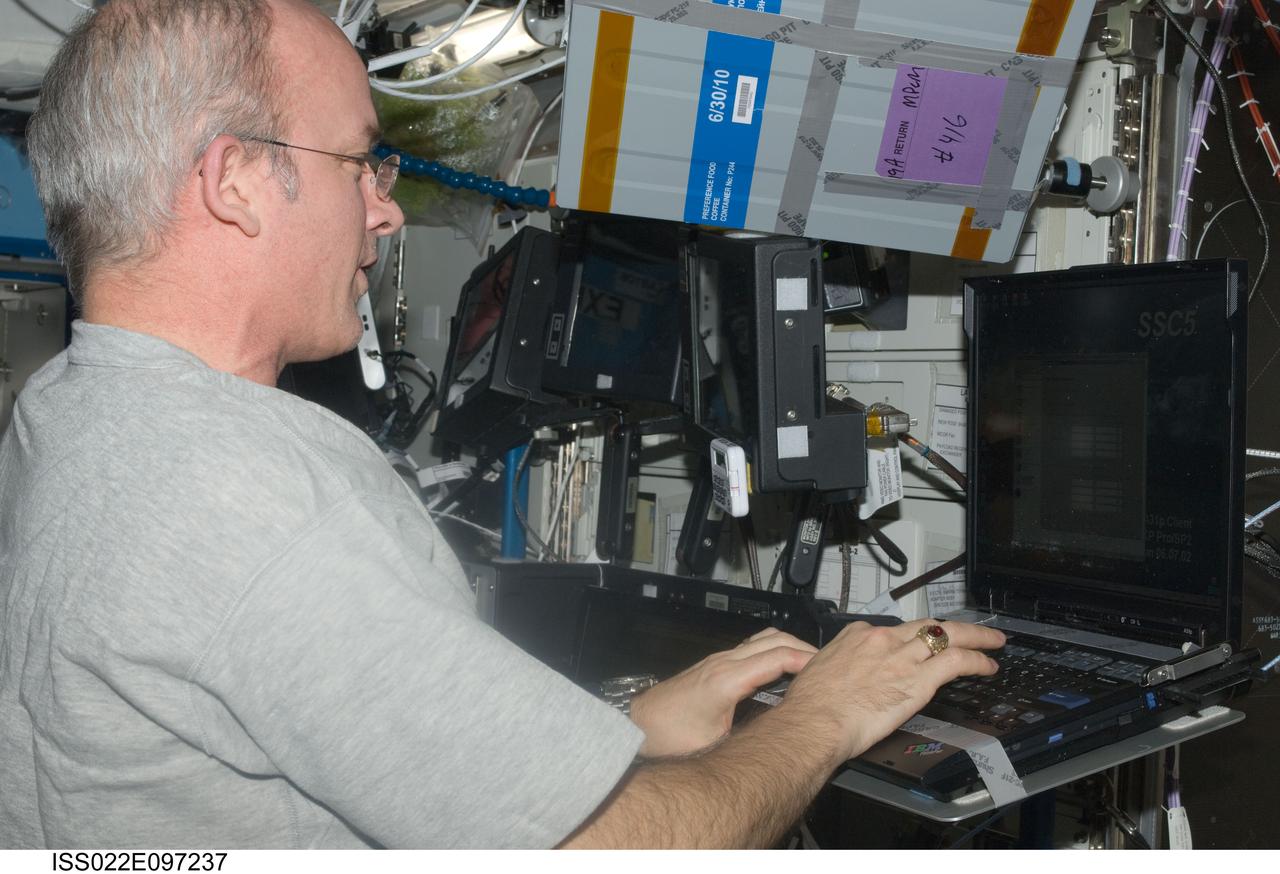 ISS022-E-097237 (14 March 2010) --- NASA astronaut Jeffrey Williams, Expedition 22 commander, uses a computer in the Destiny laboratory of the International Space Station.