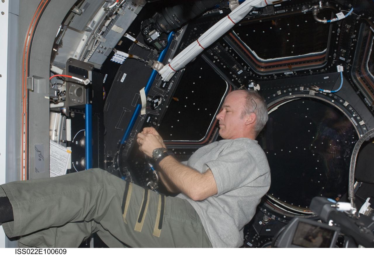 ISS022-E-100609 (17 March 2010) --- NASA astronaut Jeffrey Williams, Expedition 22 commander, is pictured near the windows in the Cupola of the International Space Station.