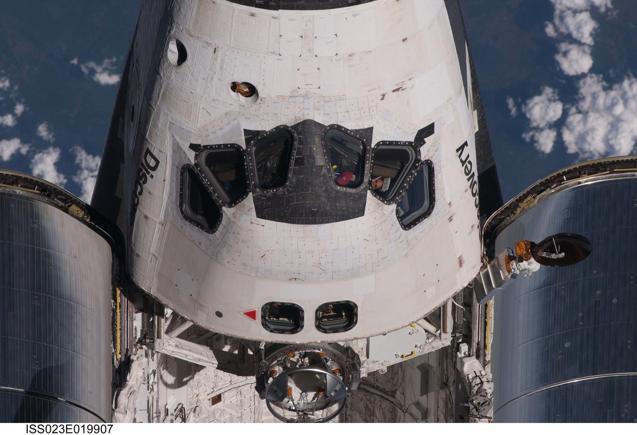 ISS023-E-019907 (7 April 2010) --- This partial view of the crew cabin and forward payload bay of the space shuttle Discovery was provided by an Expedition 23 crew member during a survey of the approaching vehicle prior to docking with the International Space Station. As part of the survey and part of every mission's activities, the STS-131 Discovery crew performed a back-flip for the rendezvous pitch maneuver (RPM). The image was photographed with a digital still camera, using a 400mm lens at a distance of about 600 feet (180 meters).