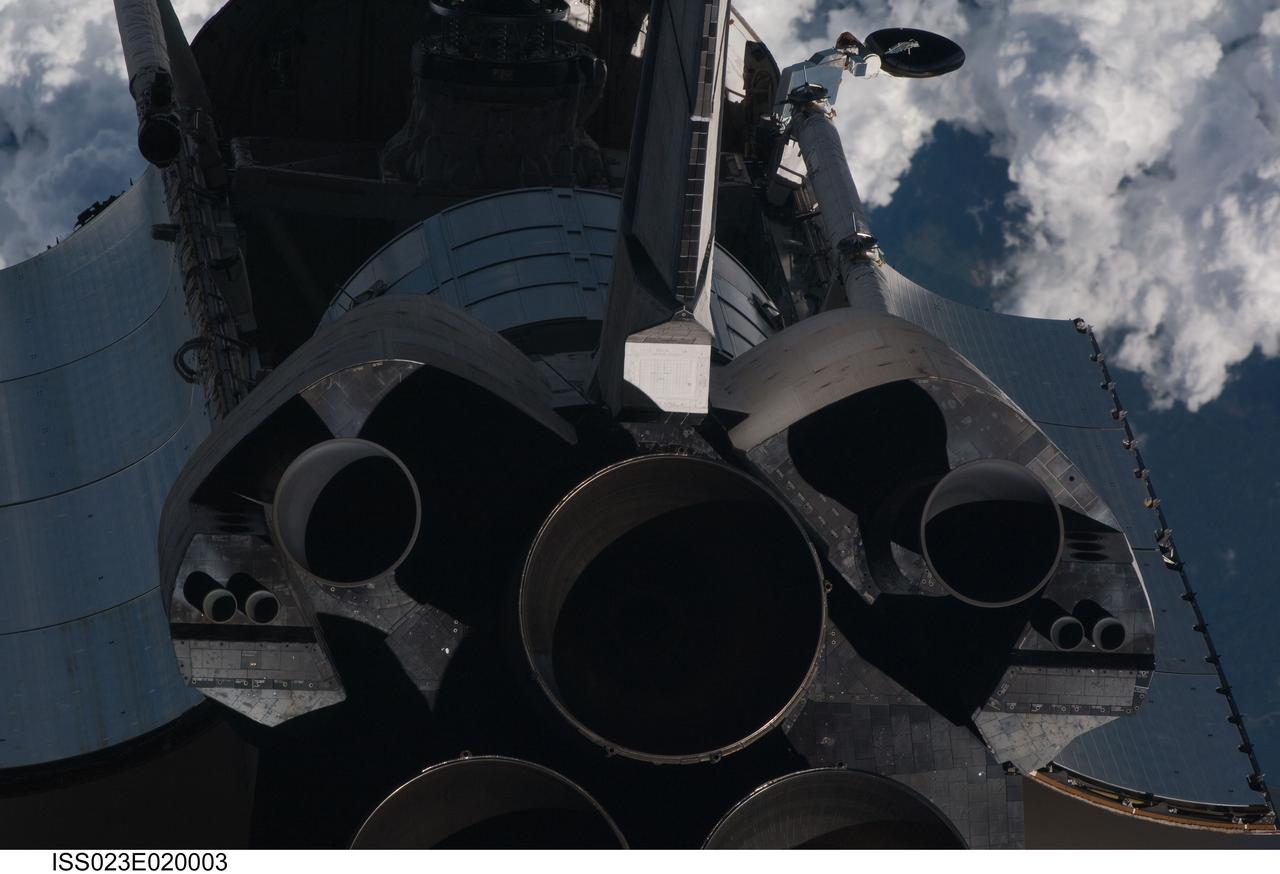ISS023-E-020003 (7 April 2010) --- This view of the aft portion of the space shuttle Discovery, including the three main engines and part of the cargo bay, was provided by an Expedition 23 crew member during a survey of the approaching vehicle prior to docking with the International Space Station. As part of the survey and part of every mission's activities, the STS-131 Discovery crew performed a back-flip for the rendezvous pitch maneuver (RPM). The image was photographed with a digital still camera, using a 400mm lens at a distance of about 600 feet (180 meters).