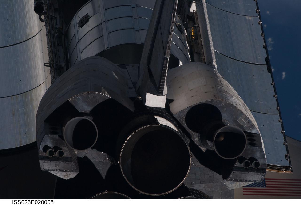 ISS023-E-020005 (7 April 2010) --- This view of the aft portion of the space shuttle Discovery, including the three main engines, part of the cargo bay, vertical stabilizer and orbital maneuvering system (OMS) pods, was provided by an Expedition 23 crew member during a survey of the approaching vehicle prior to docking with the International Space Station. As part of the survey and part of every mission's activities, the STS-131 Discovery crew performed a back-flip for the rendezvous pitch maneuver (RPM). The image was photographed with a digital still camera, using a 400mm lens at a distance of about 600 feet (180 meters). The multi-purpose logistics module Leonardo is visible in the cargo bay.