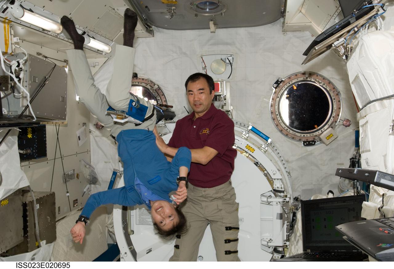 ISS023-E-020695 (7 April 2010) --- Marking the first occasion of more than one astronaut representing the Japan Aerospace Space Agency onboard any space vehicle at any time in history, JAXA astronauts Soichi Noguchi and Naoko Yamazaki reunite in the Japanese Kibo laboratory aboard the International Space Station shortly after it docked with the space shuttle Discovery on April 7. Noguchi, Expedition 22/23 flight engineer, is in the back end of a six month stay aboard the orbital complex. Yamazaki is a mission specialist with the STS-131 crew.