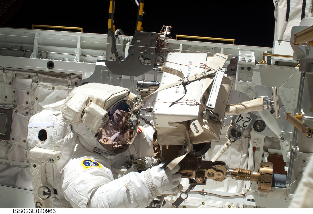 ISS023-E-020963 (9 April 2010) --- NASA astronaut Clayton Anderson, STS-131 mission specialist, participates in the mission's first session of extravehicular activity (EVA) as construction and maintenance continue on the International Space Station. During the six-hour, 27-minute spacewalk, Anderson and Rick Mastracchio (out of frame), mission specialist, helped move a new 1,700-pound ammonia tank from space shuttle Discovery’s cargo bay to a temporary parking place on the station, retrieved an experiment from the Japanese Kibo Laboratory exposed facility and replaced a Rate Gyro Assembly on one of the truss segments.
