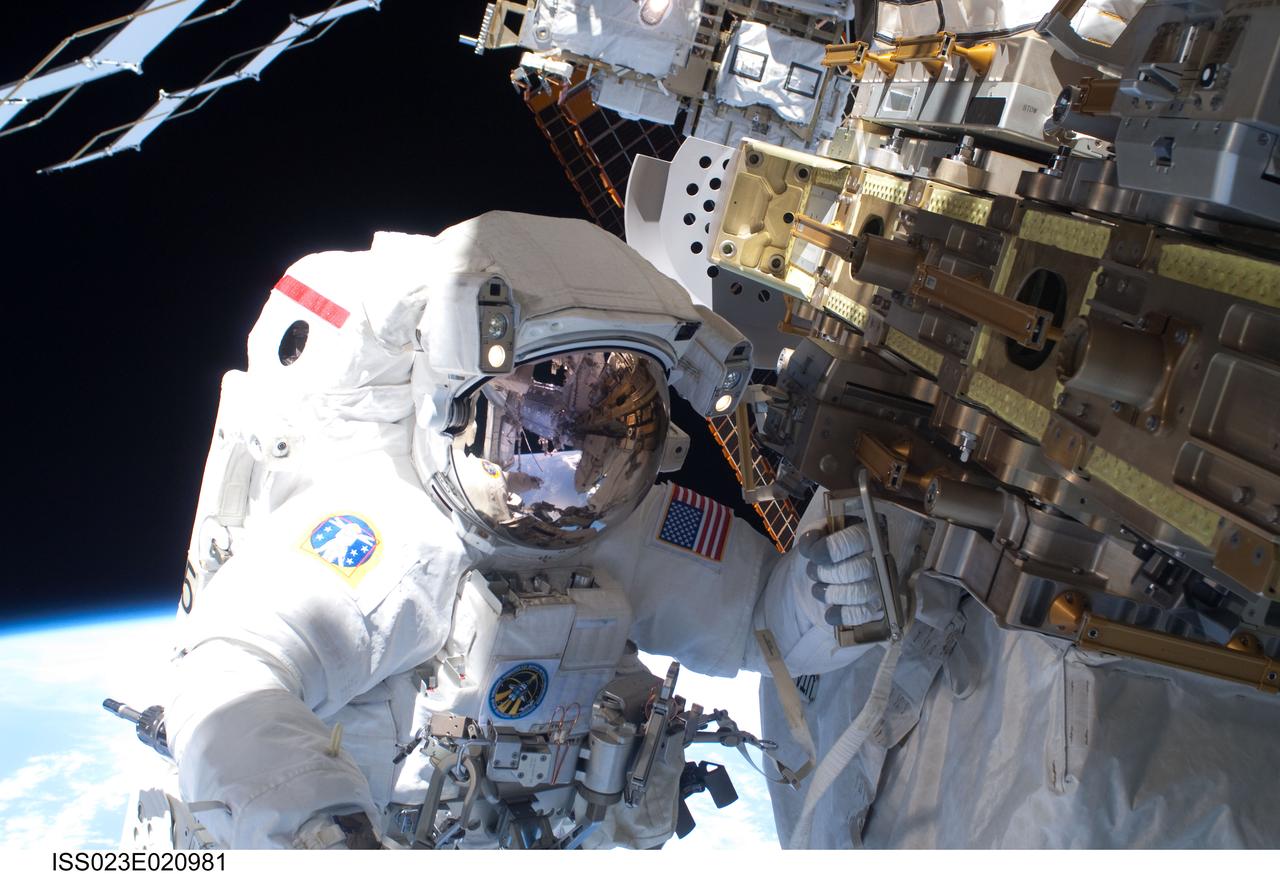 ISS023-E-020981 (9 April 2010) --- NASA astronaut Rick Mastracchio, STS-131 mission specialist, participates in the mission's first session of extravehicular activity (EVA) as construction and maintenance continue on the International Space Station. During the six-hour, 27-minute spacewalk, Mastracchio and astronaut Clayton Anderson (out of frame), mission specialist, helped move a new 1,700-pound ammonia tank from space shuttle Discovery’s cargo bay to a temporary parking place on the station, retrieved an experiment from the Japanese Kibo Laboratory exposed facility and replaced a Rate Gyro Assembly on one of the truss segments.