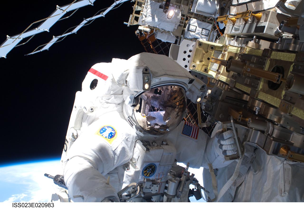 ISS023-E-020983 (9 April 2010) --- NASA astronaut Rick Mastracchio, STS-131 mission specialist, participates in the mission's first session of extravehicular activity (EVA) as construction and maintenance continue on the International Space Station. During the six-hour, 27-minute spacewalk, Mastracchio and astronaut Clayton Anderson (out of frame), mission specialist, helped move a new 1,700-pound ammonia tank from space shuttle Discovery’s cargo bay to a temporary parking place on the station, retrieved an experiment from the Japanese Kibo Laboratory exposed facility and replaced a Rate Gyro Assembly on one of the truss segments.