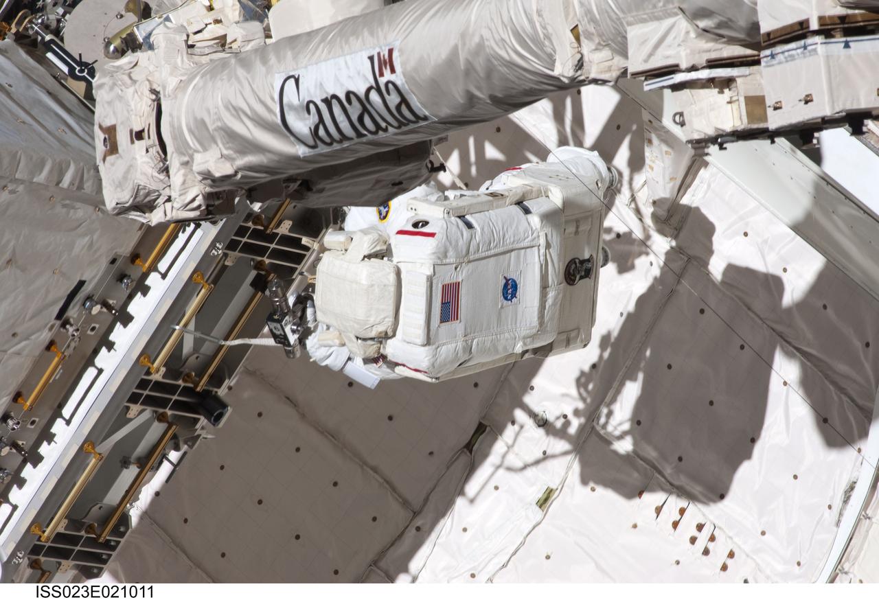 ISS023-E-021011 (9 April 2010) --- NASA astronaut Rick Mastracchio, STS-131 mission specialist, participates in the mission's first session of extravehicular activity (EVA) as construction and maintenance continue on the International Space Station. During the six-hour, 27-minute spacewalk, Mastracchio and astronaut Clayton Anderson (out of frame), mission specialist, helped move a new 1,700-pound ammonia tank from space shuttle Discovery’s cargo bay to a temporary parking place on the station, retrieved an experiment from the Japanese Kibo Laboratory exposed facility and replaced a Rate Gyro Assembly on one of the truss segments.