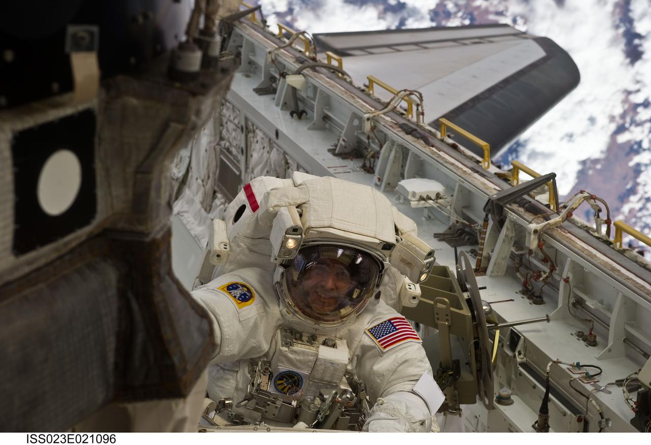 ISS023-E-021096 (9 April 2010) --- NASA astronaut Rick Mastracchio, STS-131 mission specialist, participates in the mission's first session of extravehicular activity (EVA) as construction and maintenance continue on the International Space Station. During the six-hour, 27-minute spacewalk, Mastracchio and astronaut Clayton Anderson (out of frame), mission specialist, helped move a new 1,700-pound ammonia tank from space shuttle Discovery’s cargo bay to a temporary parking place on the station, retrieved an experiment from the Japanese Kibo Laboratory exposed facility and replaced a Rate Gyro Assembly on one of the truss segments.