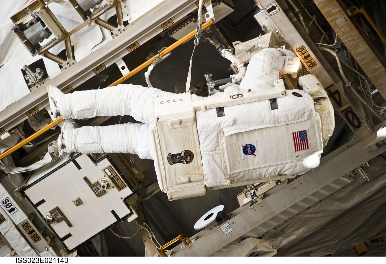 ISS023-E-021143 (9 April 2010) --- NASA astronaut Clayton Anderson, STS-131 mission specialist, participates in the mission's first session of extravehicular activity (EVA) as construction and maintenance continue on the International Space Station. During the six-hour, 27-minute spacewalk, Anderson and astronaut Rick Mastracchio (out of frame), mission specialist, helped move a new 1,700-pound ammonia tank from space shuttle Discovery’s cargo bay to a temporary parking place on the station, retrieved an experiment from the Japanese Kibo Laboratory exposed facility and replaced a Rate Gyro Assembly on one of the truss segments.