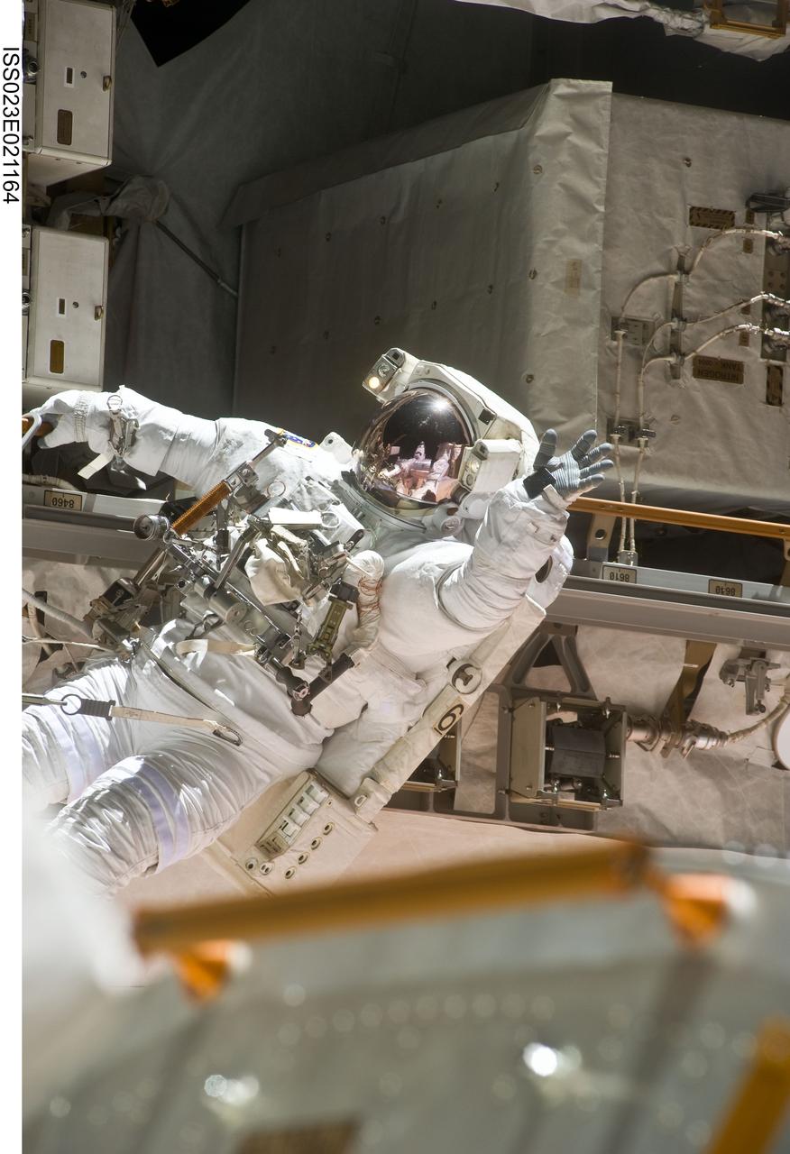 ISS023-E-021164 (9 April 2010) --- NASA astronaut Clayton Anderson, STS-131 mission specialist, participates in the mission's first session of extravehicular activity (EVA) as construction and maintenance continue on the International Space Station. During the six-hour, 27-minute spacewalk, Anderson and astronaut Rick Mastracchio (out of frame), mission specialist, helped move a new 1,700-pound ammonia tank from space shuttle Discovery’s cargo bay to a temporary parking place on the station, retrieved an experiment from the Japanese Kibo Laboratory exposed facility and replaced a Rate Gyro Assembly on one of the truss segments.