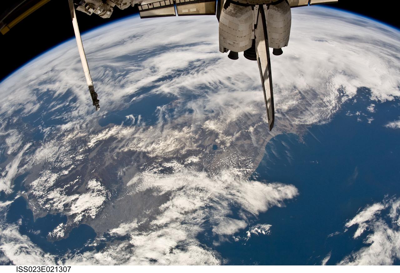 ISS023-E-021307 (10 April 2010) --- Photographed by one of the Expedition 23 crew members onboard the International Space Station 220 miles above Earth, this is a broad area view of Sendai, Japan. The end of the shuttle vertical stabilizer points to Sendai.