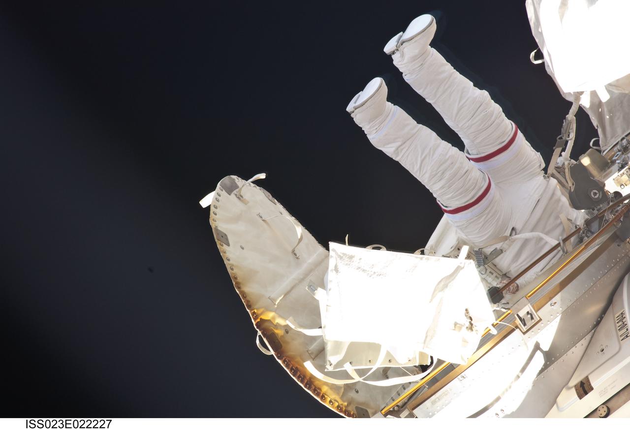 ISS023-E-022227 (13 April 2010) --- NASA astronaut Rick Mastracchio, STS-131 mission specialist, works near the Quest airlock during the mission's third and final session of extravehicular activity (EVA) as construction and maintenance continue on the International Space Station. During the six-hour, 24-minute spacewalk, Mastracchio and astronaut Clayton Anderson (out of frame), mission specialist, hooked up fluid lines of the new 1,700-pound tank, retrieved some micrometeoroid shields from the Quest airlock’s exterior, relocated a portable foot restraint and prepared cables on the Zenith 1 truss for a spare Space to Ground Ku-Band antenna, two chores required before space shuttle Atlantis' STS-132/ULF-4 mission in May.